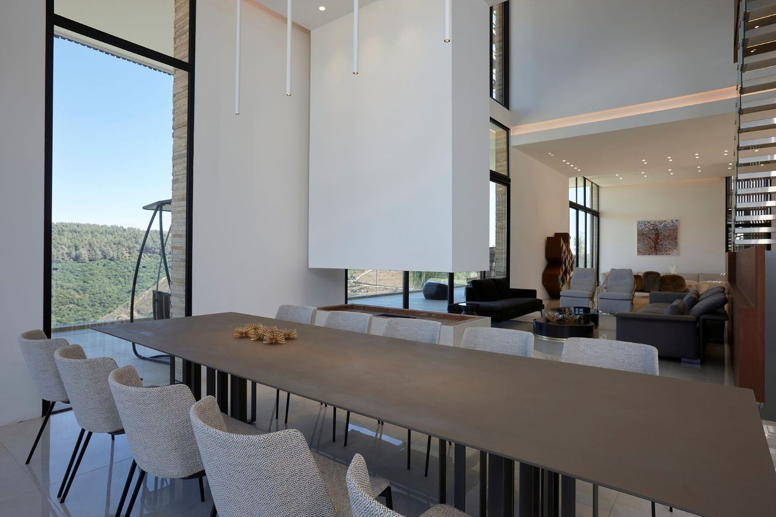 double-height dining, drawn toward the valley