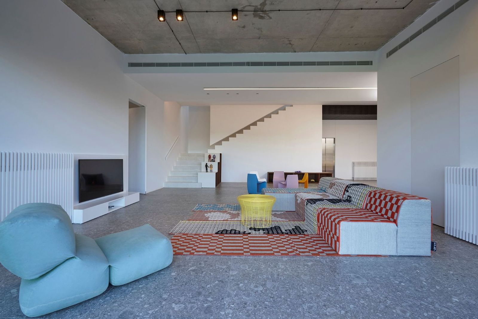 the family room beneath board-marked concrete